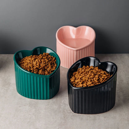 Slanted Ceramic Cat Bowl Stand Anti Tip Elevated pink heart bowl dark background lifestyle