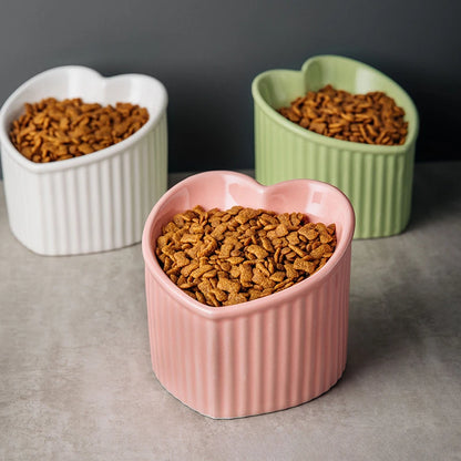 Slanted Ceramic Cat Bowl Stand Anti Tip Elevated pink bowl single lifestyle dark background